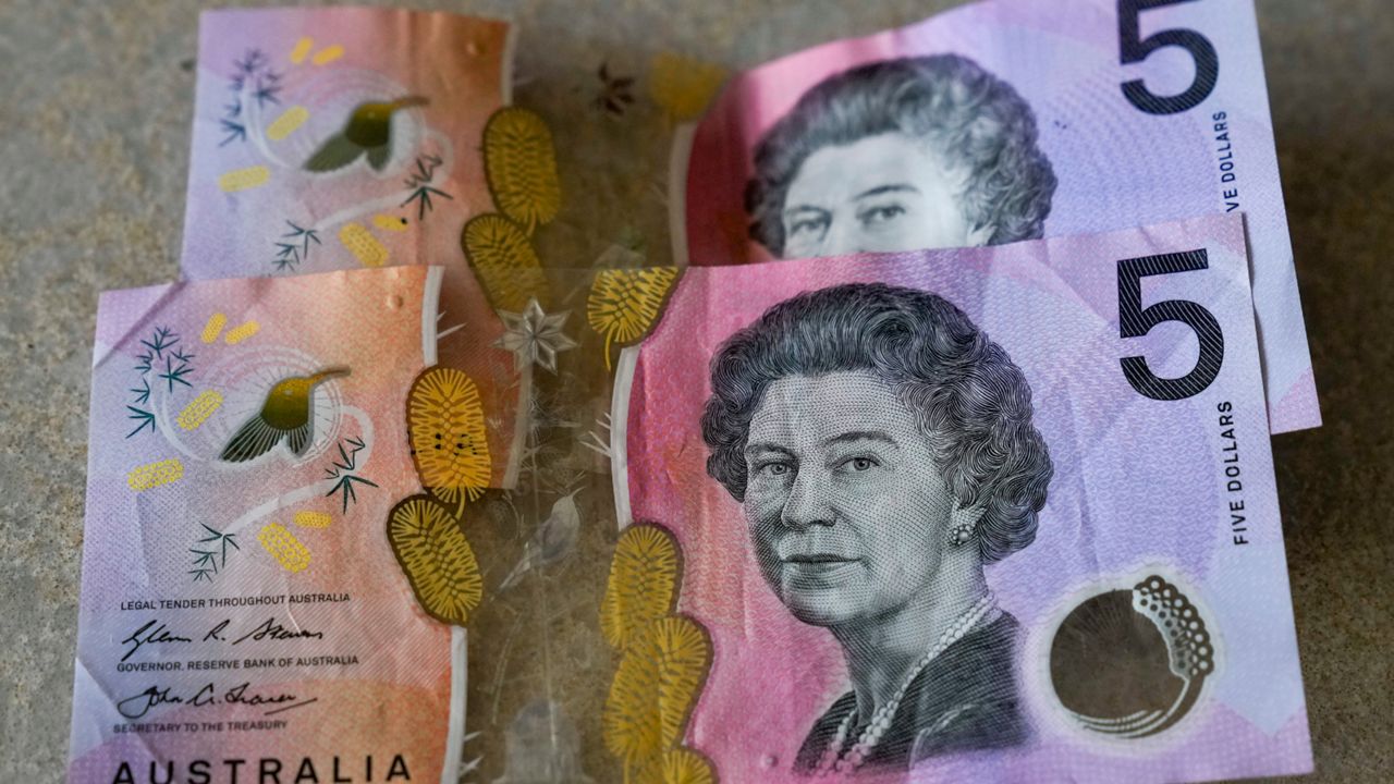 Australian $5 notes are pictured in Sydney, on Sept. 10, 2022. Many regarded Australians’ respect and affection for the late Queen Elizabeth II as the biggest obstacle to the country becoming a republic with its own head of state. Now after her death and with a pro-republic Labor Party government in power, Australia’s constitutional ties to the British monarchy will again be open to first-order debate for the first time since change was rejected at a 1999 referendum.(AP Photo/Mark Baker, File)