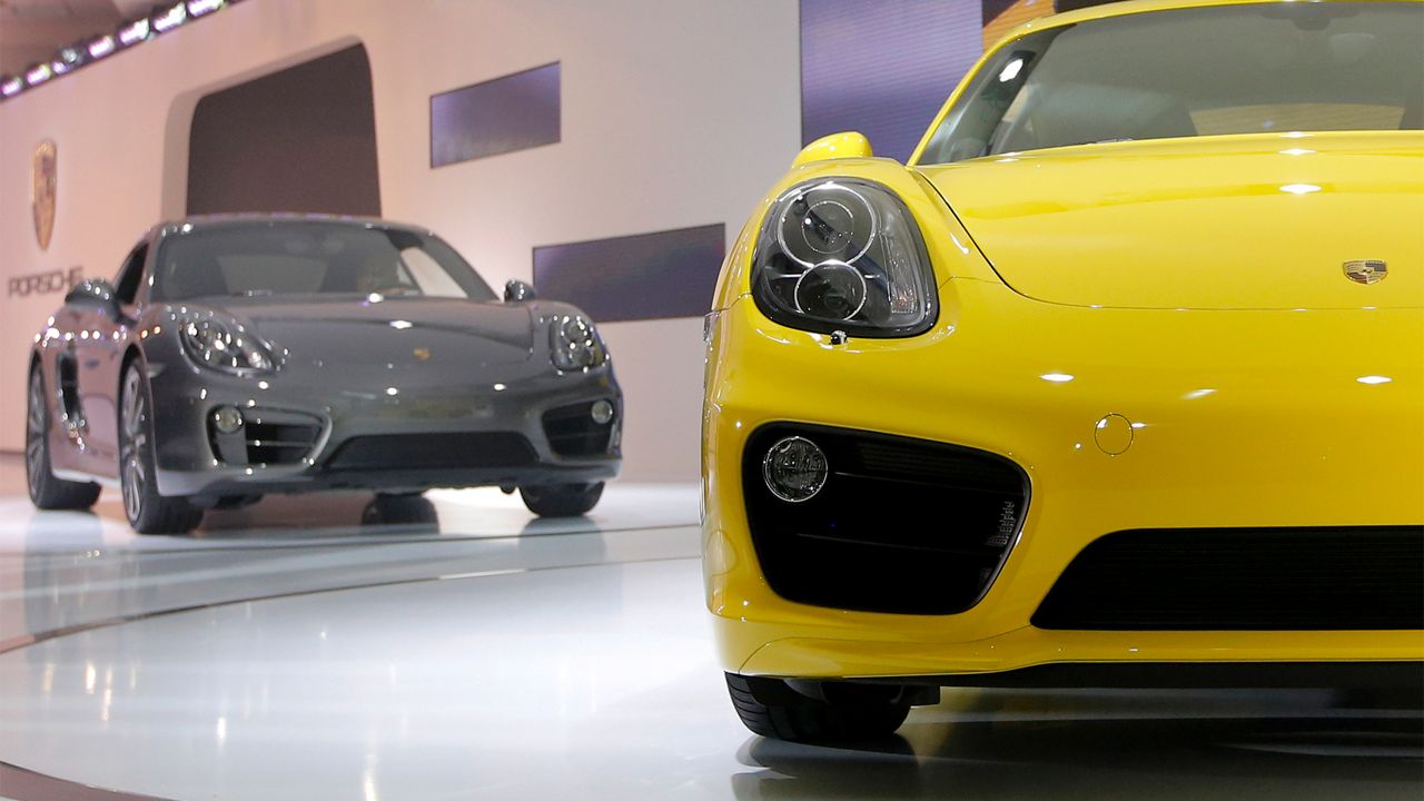 The new Porsche Caymans are introduced at the LA Auto Show in Los Angeles, Wednesday, Nov. 28, 2012. (AP Photo/Jae C. Hong)