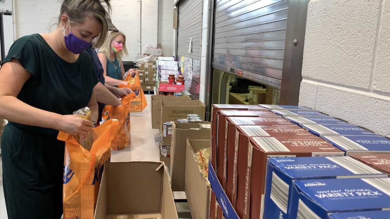 teachers with food donations
