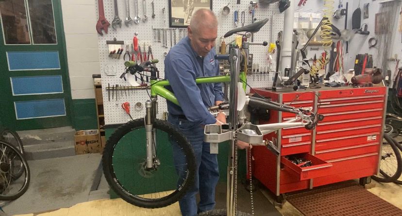 Babcock works on a bike in his shop.