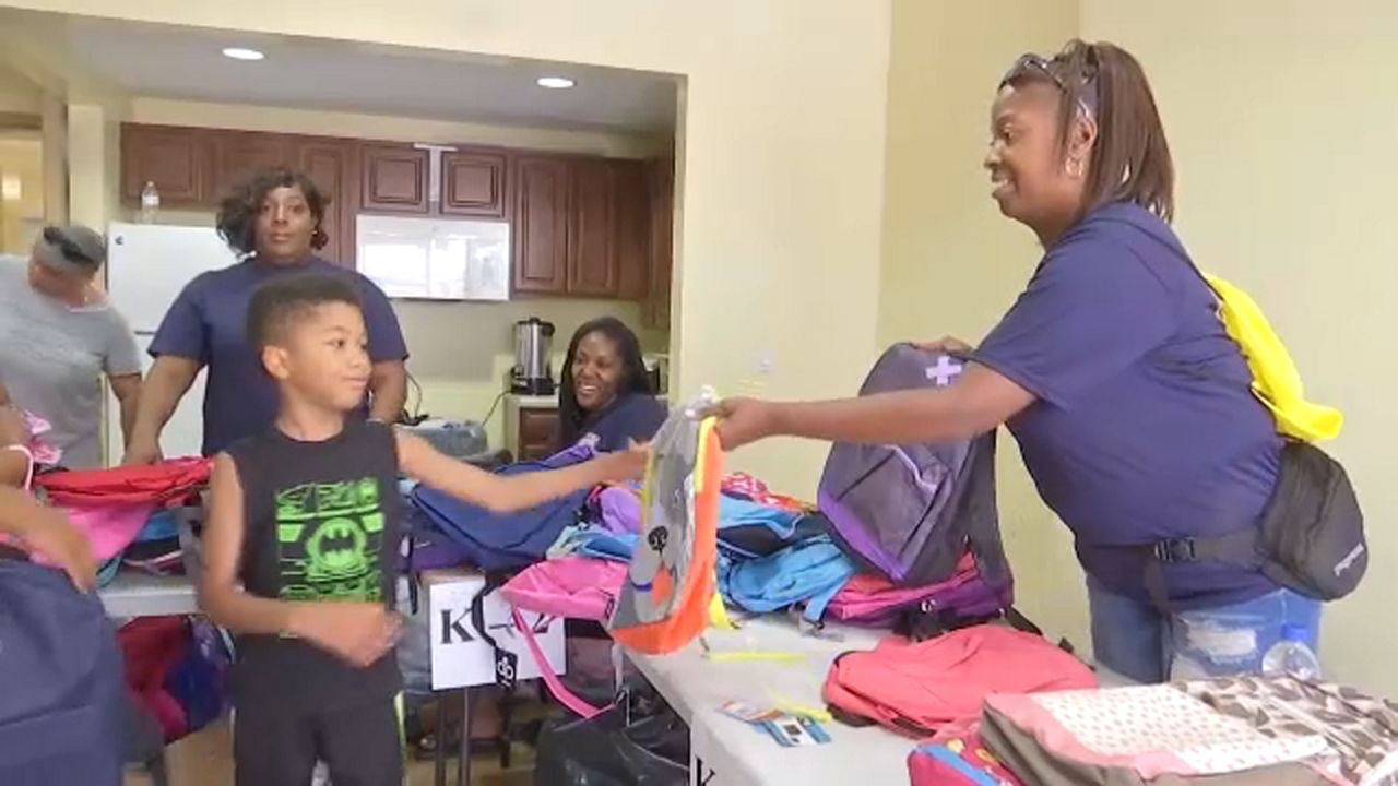 Correction Officer group gives away 3,000 backpacks