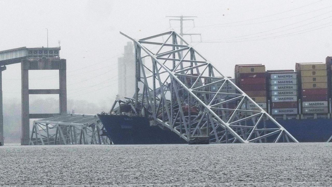 A container ship rests against the wreckage of the Francis Scott Key Bridge on Thursday, March 28, 2024, in Baltimore, Md. (AP Photo/Matt Rourke, File)