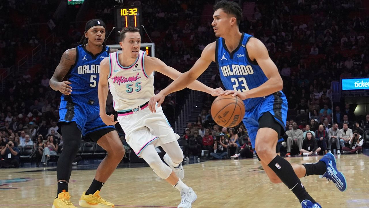 Orlando Magic forward Tristan da Silva (23) drives to the basket as Miami Heat forward Duncan Robinson defends during the first half of an NBA basketball game, Monday, Jan. 27, 2025, in Miami. (AP Photo/Lynne Sladky)