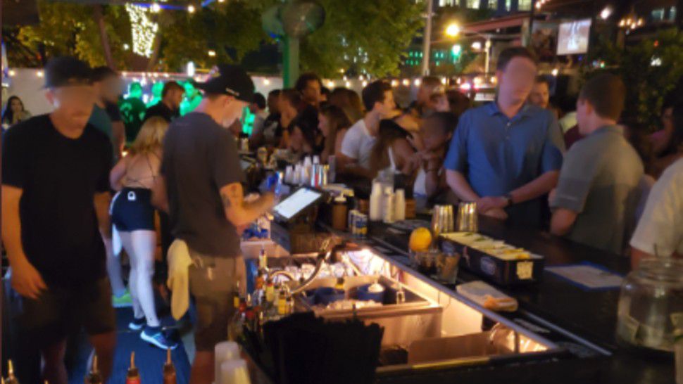 Patrons appear at the Whiskey Tango Foxtrot Icehouse in Austin, Texas, prior to the establishment's alcohol permit being suspended in this image from June 20, 2020. (TABC/Twitter)