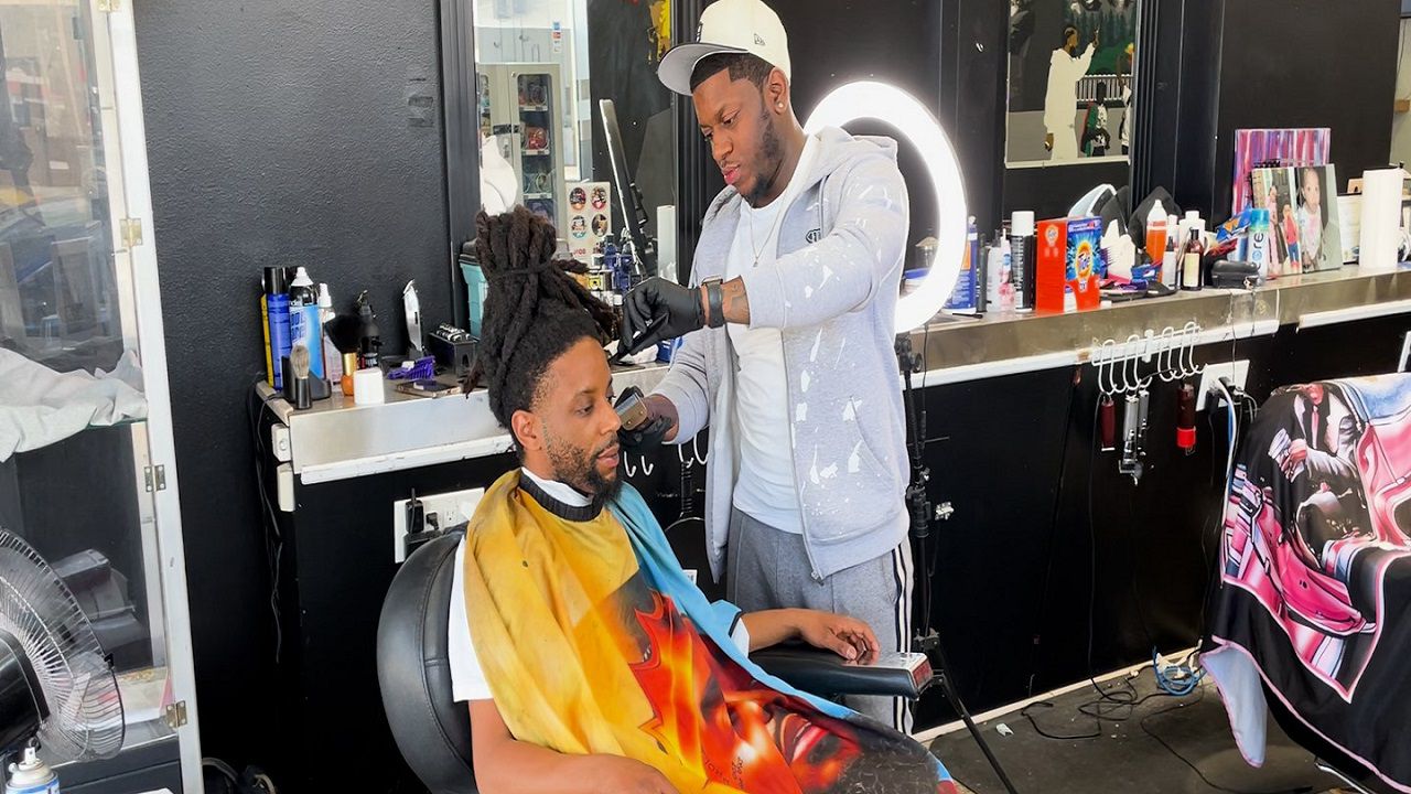 Tevin Whiteside gets a haircut at Urban Renaissance By Prestige in Greensboro.