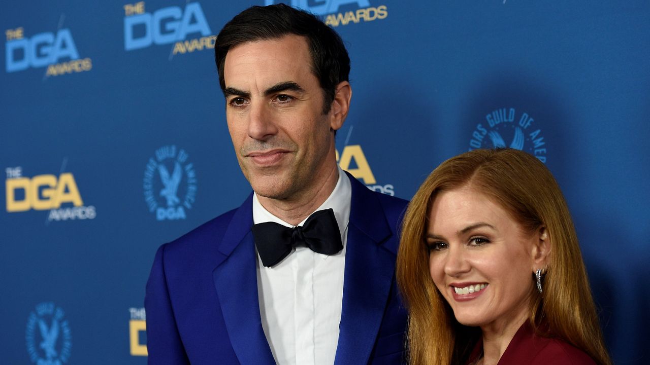 Sacha Baron Cohen, left, and Isla Fisher arrive at the 71st annual DGA Awards at the Ray Dolby Ballroom on Feb. 2, 2019, in Los Angeles. (Photo by Chris Pizzello/Invision/AP)