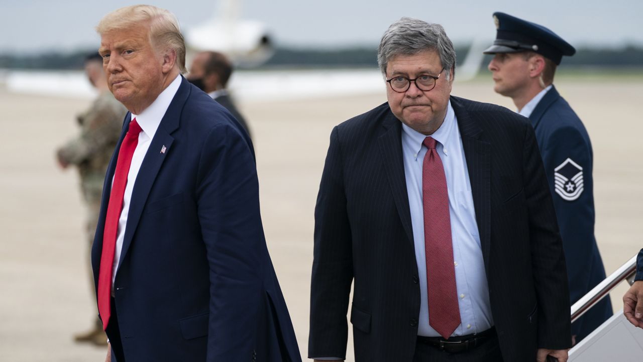 President Donald Trump and Attorney General William Barr arrive at Andrews Air Force Base, Md., on Sept. 1, 2020. (AP Photo/Evan Vucci, File)