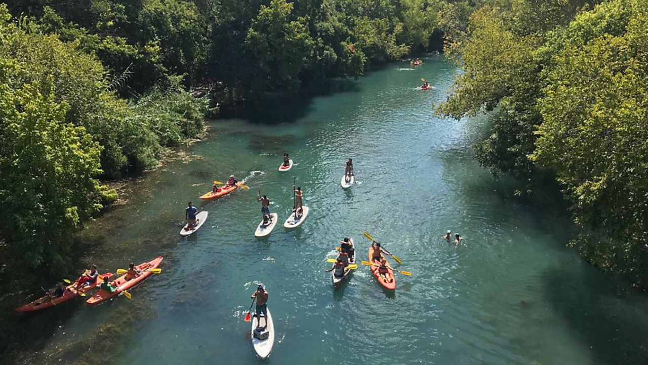 People wake board at Barton Springs Pool. (Spectrum News 1/FILE)