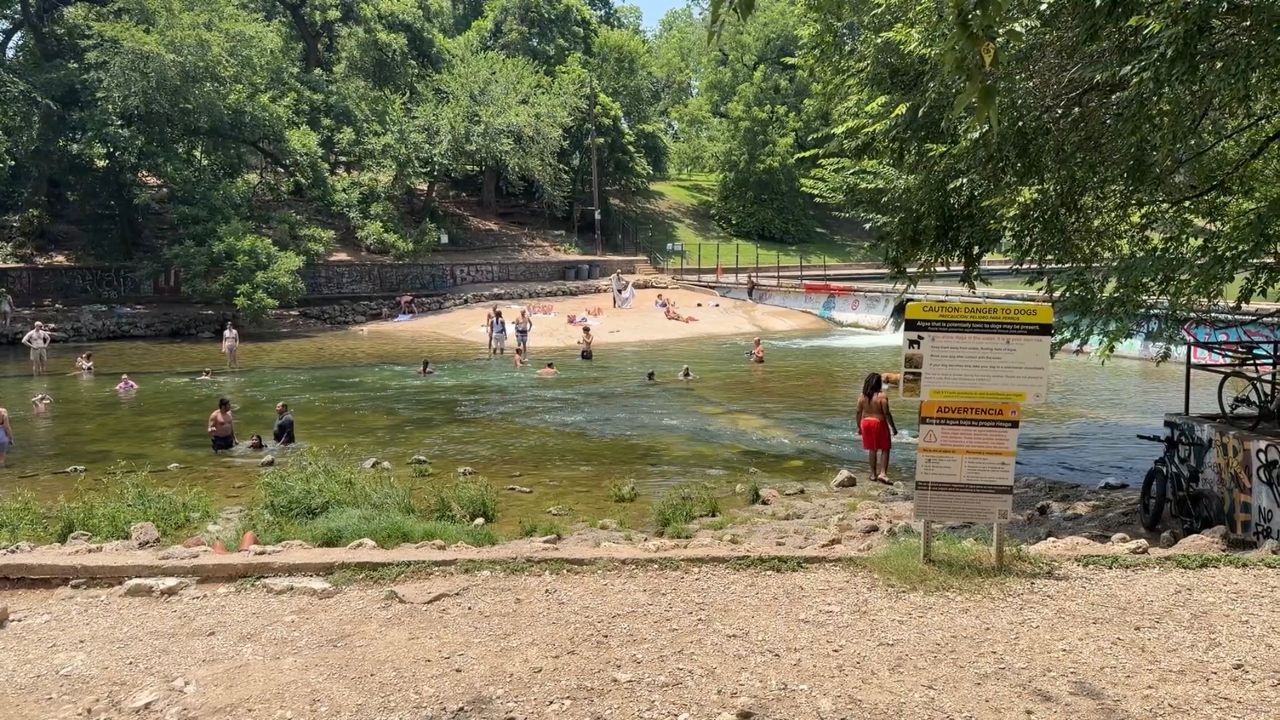 Austinites cool off at Barton Springs during extreme heat warning