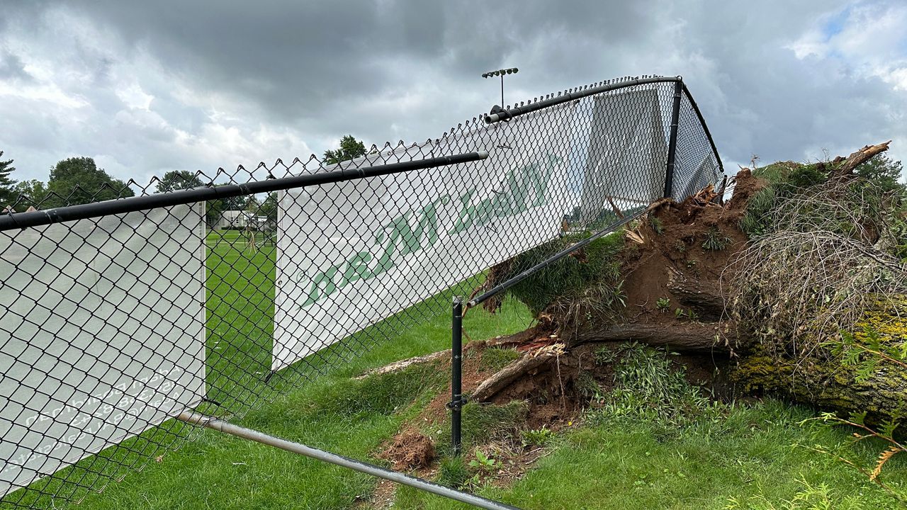 damaged fence at baseball field