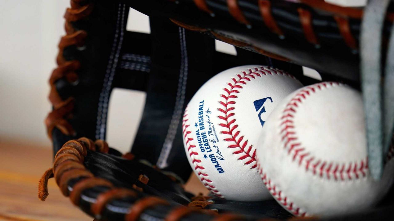 Baseballs in a glove.