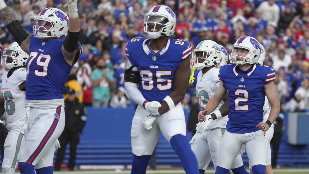 Buffalo Bills place kicker Tyler Bass (2) and tight end Quintin Morris (85) watch after Bass kicked the game winning field goal during the second half of an NFL football game against the Miami Dolphins, Sunday, Nov. 3, 2024, in Orchard Park, N.Y. (AP Photo/Gene Puskar)