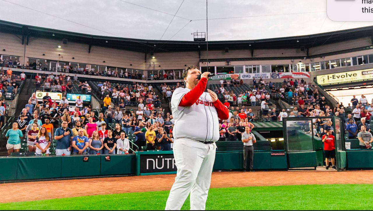 Rochester Red Wings bat boy sings at game