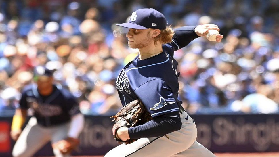 Tampa Bay Rays starting pitcher Shane Baz throws to a Toronto Blue Jays batter in the first inning of a baseball game in Toronto, Sunday, July 3, 2022. (Jon Blacker/The Canadian Press via AP)