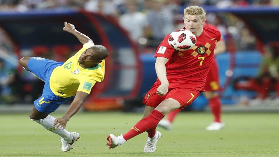 Brazil’s Fernandinho, left, and Belgium’s Kevin De Bruyne challenge for the ball during the quarterfinal match between Brazil and Belgium at the 2018 soccer World Cup in the Kazan Arena, in Kazan, Russia, Friday, July 6, 2018. (AP Photo/Frank Augstein)