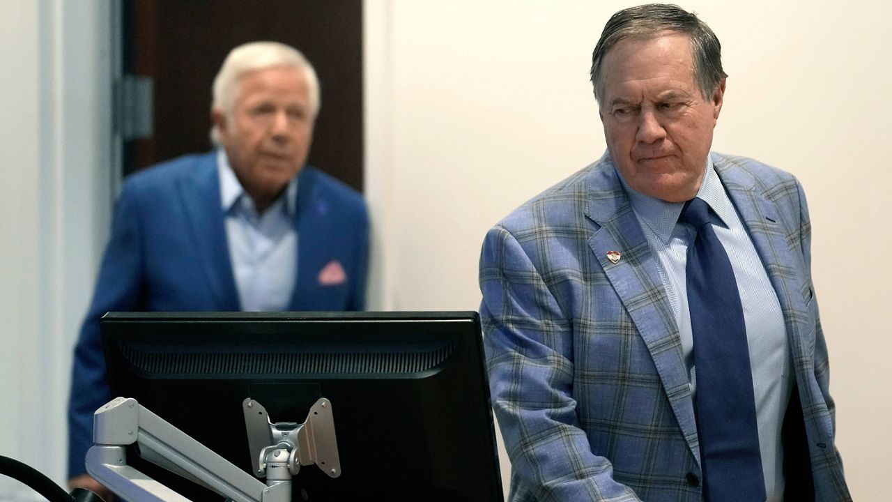 Former New England Patriots head coach Bill Belichick, right, and Patriots owner Robert Kraft, left, arrive for an NFL football news conference, Thursday, Jan. 11, 2024, in Foxborough, Mass., to announce that Belichick, a six-time NFL champion, has agreed to part ways with the team. (AP Photo/Steven Senne)