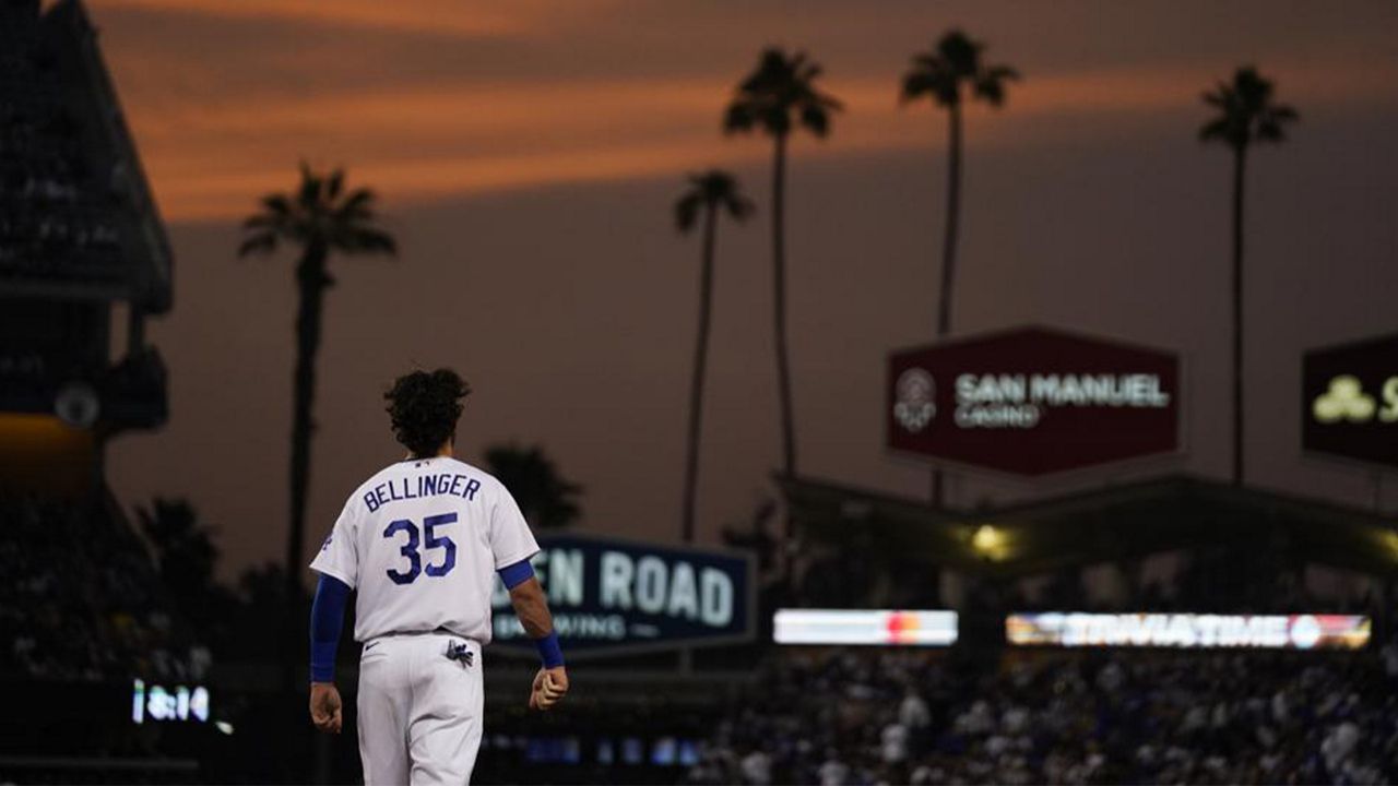 Los Angeles Dodgers' Cody Bellinger walks to his position after the third inning of a baseball game against the San Francisco Giants, Monday, June 28, 2021, in Los Angeles. (AP Photo/Jae C. Hong)