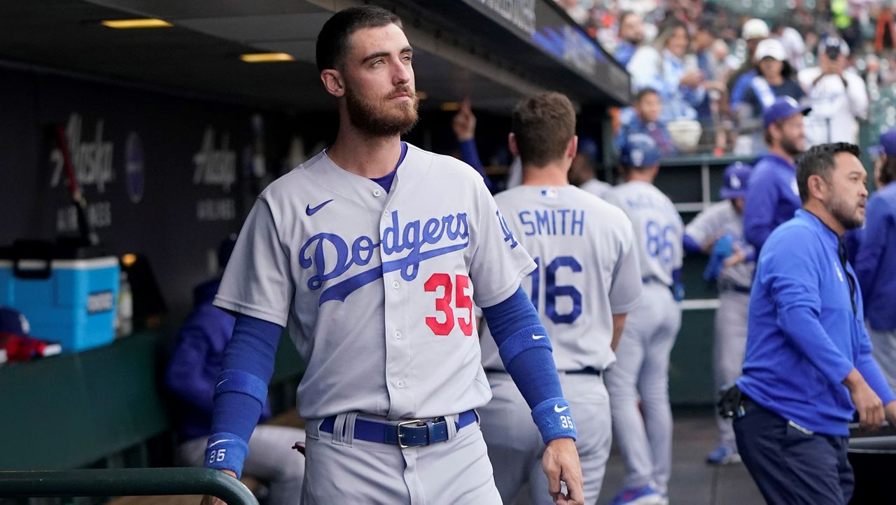 Los Angeles Dodgers' Cody Bellinger stands in the dugout before the team's baseball game against the San Francisco Giants in San Francisco, Aug. 2, 2022. (AP Photo/Jeff Chiu, File)