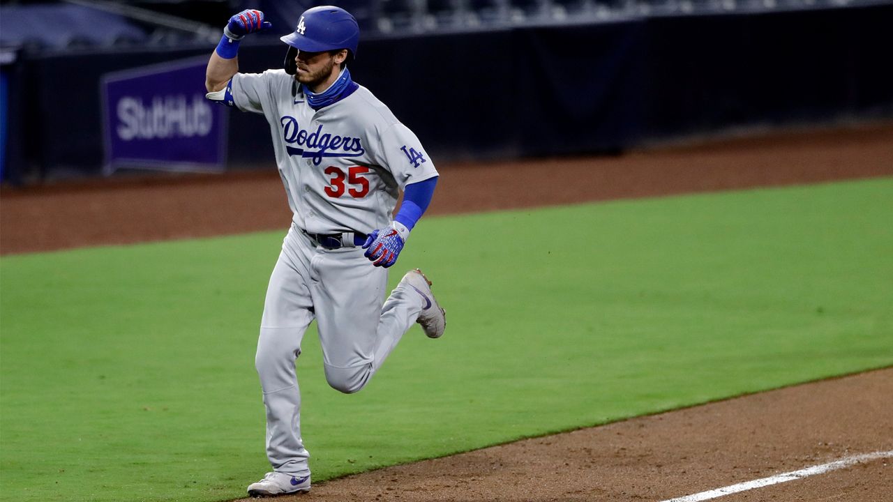 Los Angeles Dodgers' Cody Bellinger gestures after hitting a home run during the ninth inning of the team's baseball game against the San Diego Padres, Monday, Aug. 3, 2020, in San Diego. (AP Photo/Gregory Bull)