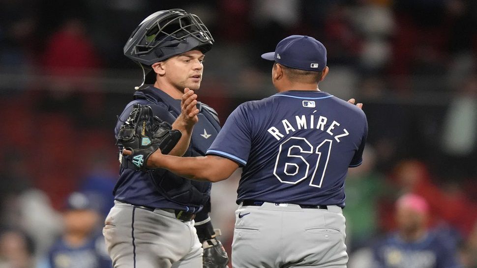 Tampa Bay Rays' Ben Rortvedt, left, celebrates with Erasmo Ramírez, right, after they defeated the Boston Red Sox in a baseball game Thursday, May 16, 2024, in Boston. (AP Photo/Steven Senne)