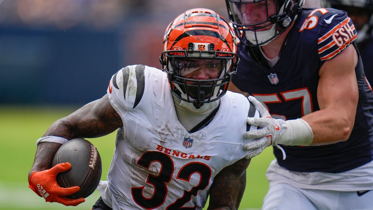 Cincinnati Bengals running back Trayveon Williams (32) runs with the ball against Chicago Bears linebacker Jack Sanborn (57) during the first half of an NFL preseason football game, Saturday, Aug. 17, 2024, at Soldier Field in Chicago. 