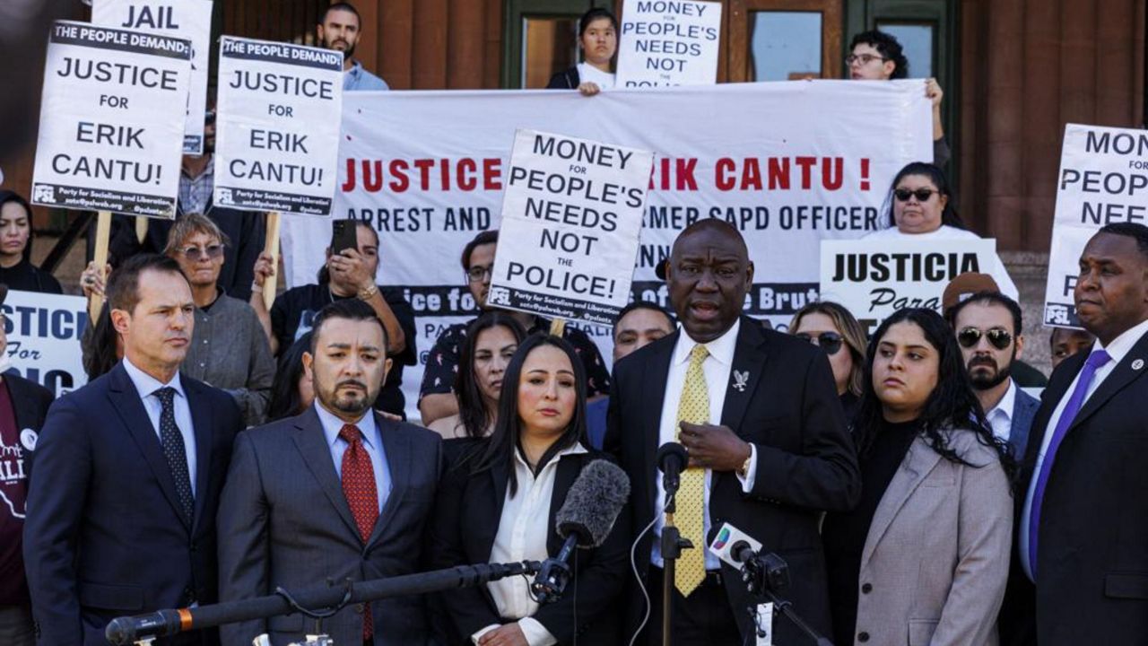 Attorney Benjamin Crump, third from right, addresses the media alongside 17-year-old Erik Cantu's family during a press conference held to update the public about his current medical condition in front of the Bexar County Courthouse in San Antonio, Tuesday, Oct. 25, 2022. (Sam Owens/The San Antonio Express-News via AP)