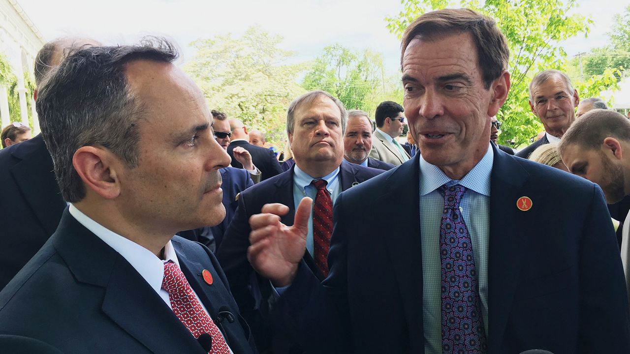 Braidy Industries Inc. CEO Craig Bouchard, right, and then-Republican Kentucky Gov. Matt Bevin speak with reporters in Wurtland, Ky., on April 26, 2017. Braidy Industries still needs to raise $500 million to build a long-promised $1.7 billion aluminum plant in Appalachia, a top company executive told Kentucky lawmakers on Tuesday, July 19, 2022. (AP Photo/Adam Beam, File)