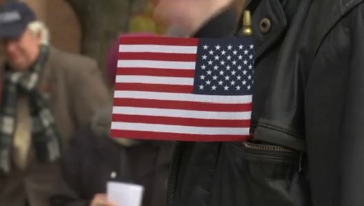 US Flag with person in background