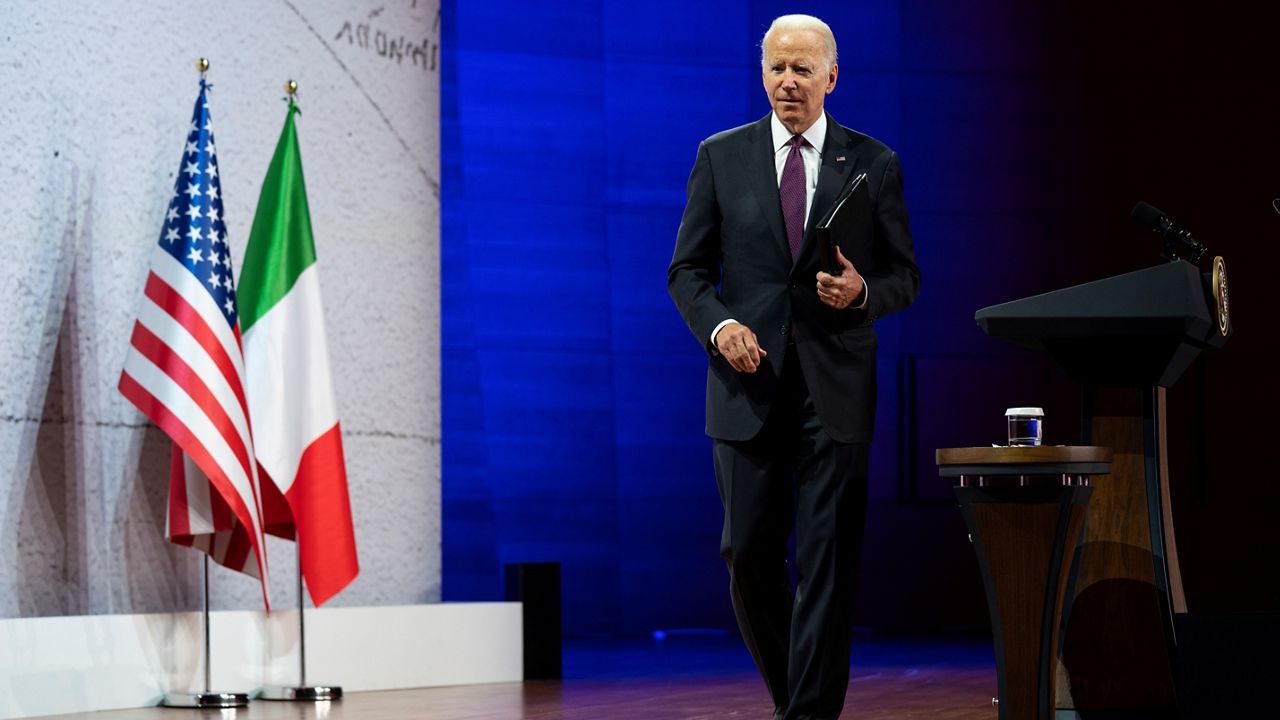 President Joe Biden walks off after speaking at a news conference at the conclusion of the G20 leaders summit, Sunday, Oct. 31, 2021, in Rome. (AP Photo/Evan Vucci)