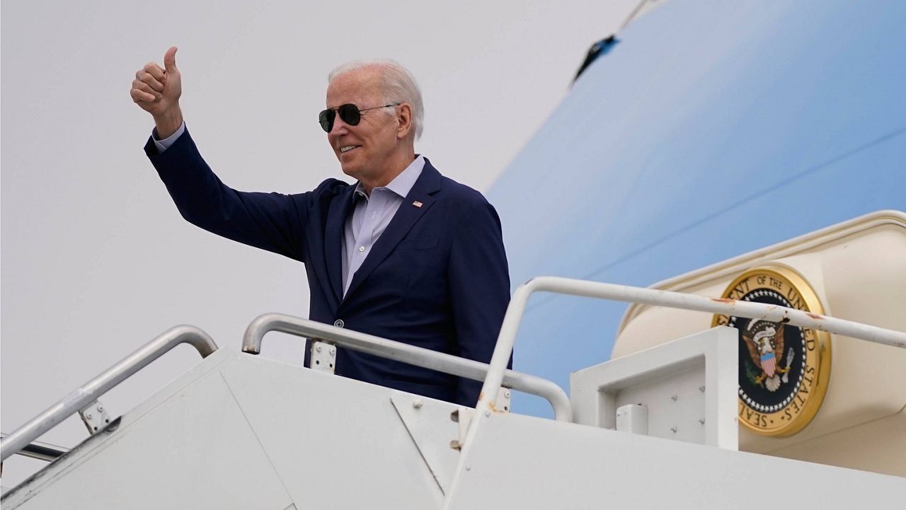 President Joe Biden motions while boarding Air Force One at Los Angeles International Airport after attending the Summit of the Americas, Saturday, June 11, 2022, in Los Angeles. (AP Photo/Evan Vucci)