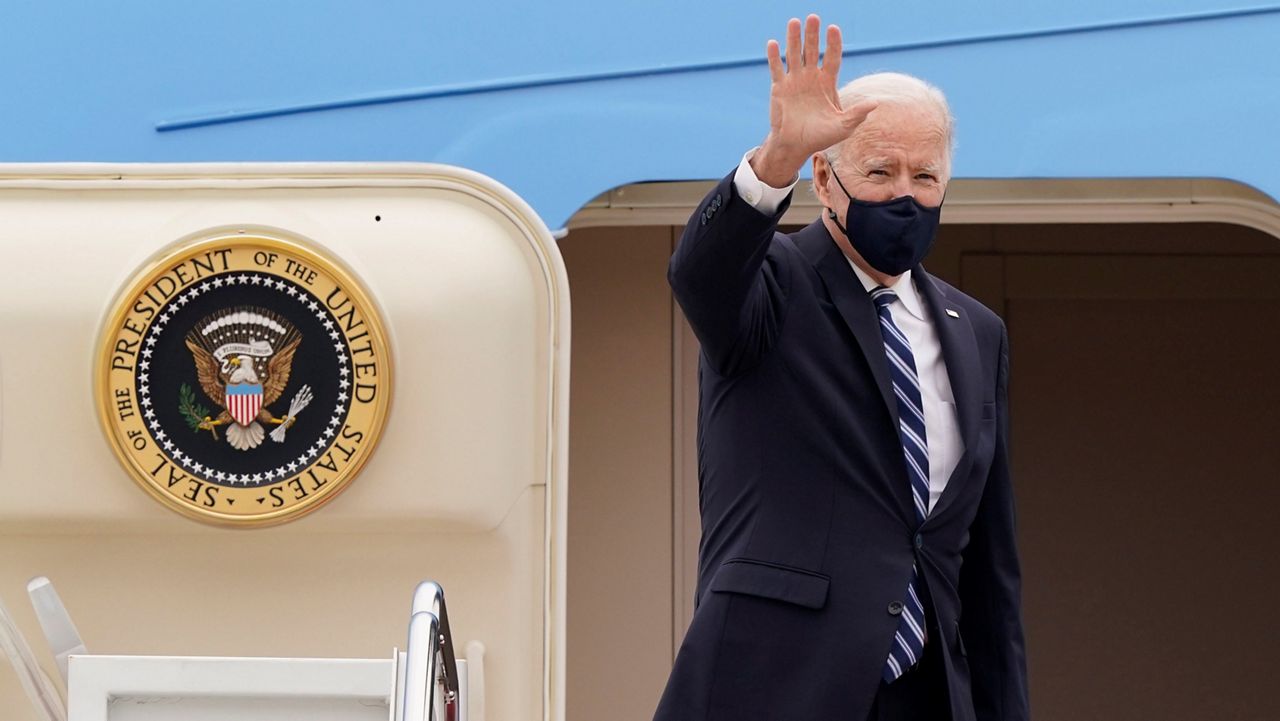 President Biden waves from the top of the steps of Air Force One at Andrews Air Force Base, Md. (AP/Susan Walsh)