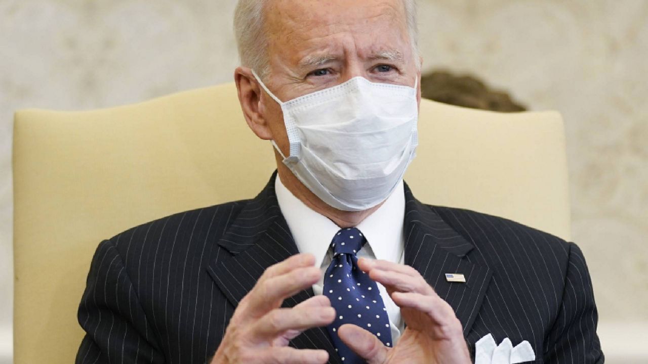 President Joe Biden, accompanied by Vice President Kamala Harris and Treasury Secretary Janet Yellen, not pictured, meets with business leaders to discuss a coronavirus relief package in the Oval Office of the White House, Tuesday, Feb. 9, 2021, in Washington. (AP Photo/Patrick Semansky)