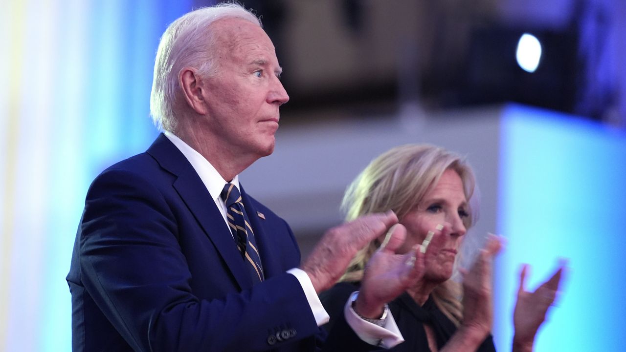 President Joe Biden, left, and first lady Jill Biden applaud before Biden delivers remarks on the 75th anniversary of NATO at the Andrew W. Mellon Auditorium, Tuesday, July 9, 2024, in Washington. (AP Photo/Evan Vucci)