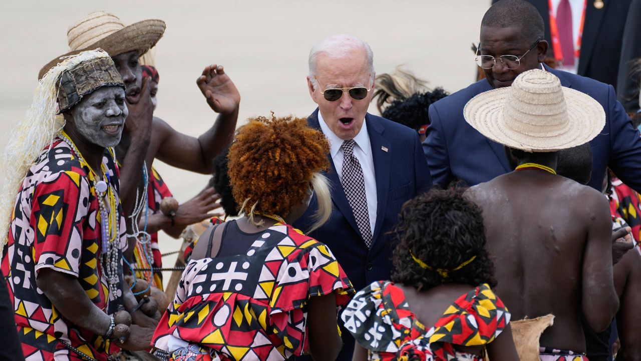 President Joe Biden watches a traditional dance after arriving at Catumbela airport in Angola on Wednesday, Dec. 4, 2024. (AP Photo/Ben Curtis)