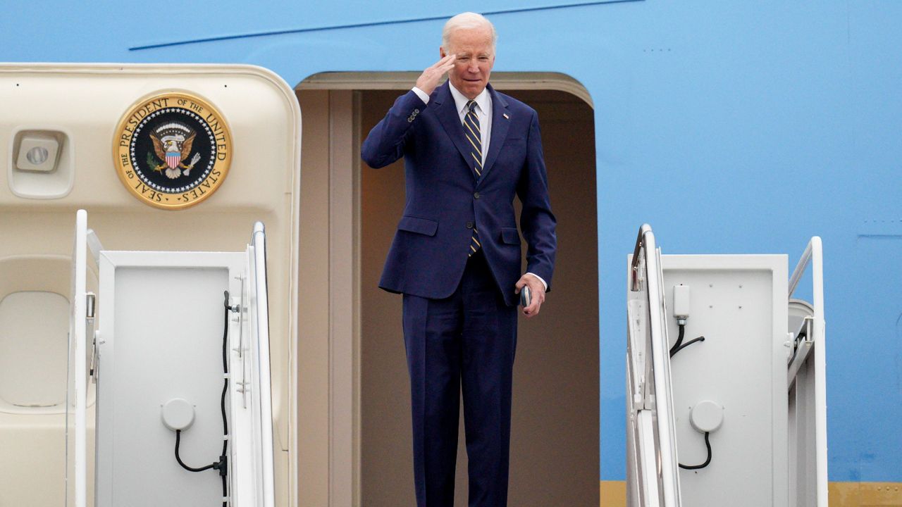 President Joe Biden returns a salute Thursday as he boards Air Force One at Andrews Air Force Base, Md., en route to California. (AP Photo/Jess Rapfogel)