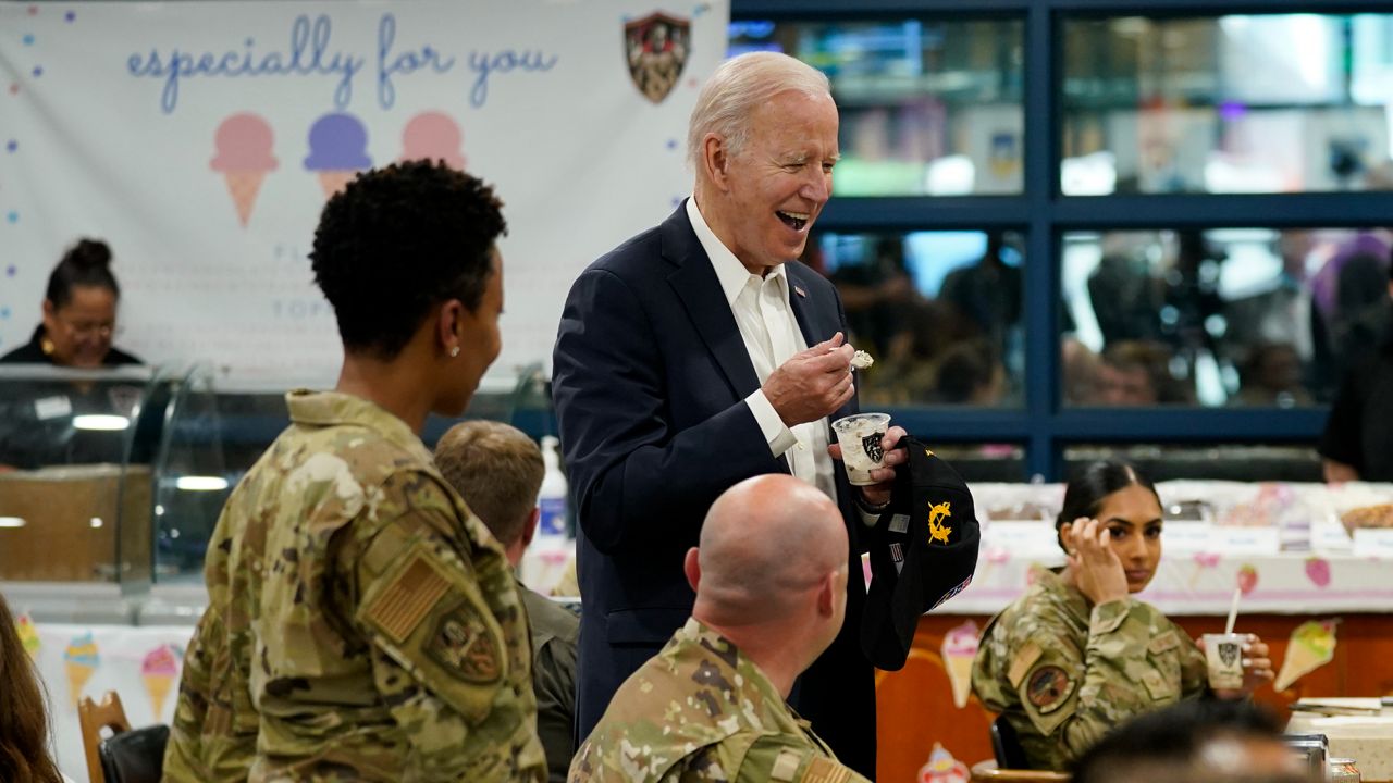 U.S. President Joe Biden eats ice cream as Biden meets with American service members and their family at Osan Air Base, Sunday, May 22, 2022, in Pyeongtaek, South Korea. (AP Photo/Evan Vucci)