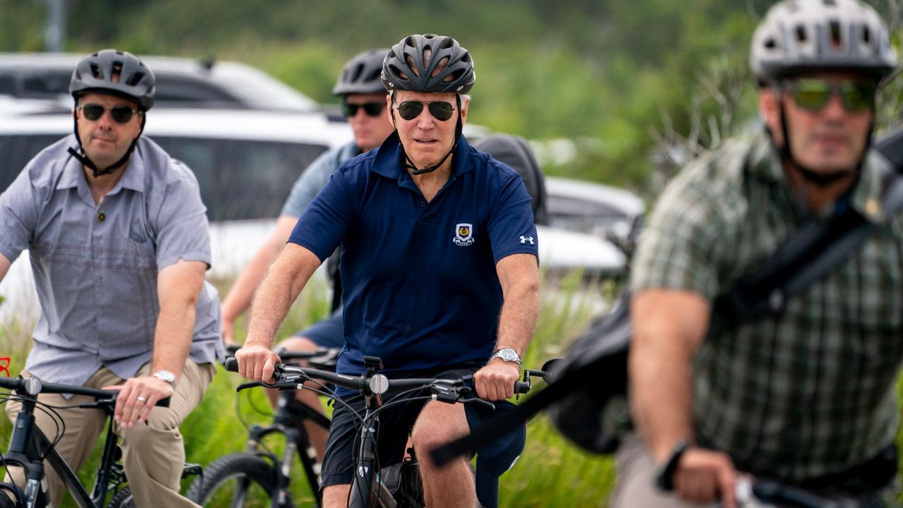 President Joe Biden goes on a bike ride Sunday in Gordons Pond State Park in Rehoboth Beach, Del. (AP Photo/Andrew Harnik)