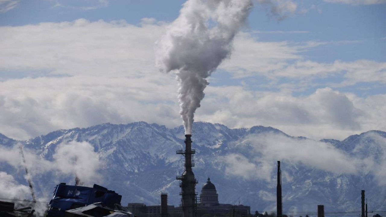 The Utah State Capitol, rear, is shown behind an oil refinery on Thursday, May 12, 2022, in Salt Lake City. President Joe Biden is promising “strong executive action” to combat climate change, despite dual setbacks that have restricted his ability to regulate carbon emissions and boost clean energy such as wind and solar power. (AP Photo/Rick Bowmer, File)