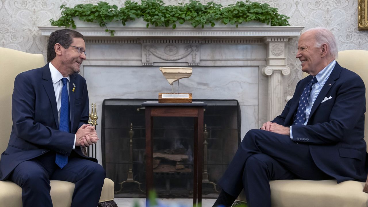 President Joe Biden meets with Israel's President Isaac Herzog, left, in the Oval Office of the White House in Washington, Tuesday, Nov. 12, 2024. (AP Photo/Ben Curtis)