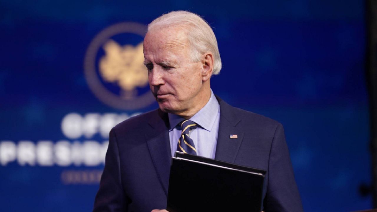 President-elect Joe Biden leaves after speaking at The Queen theater, Monday, Dec. 28, 2020, in Wilmington, Del. (AP Photo/Andrew Harnik)