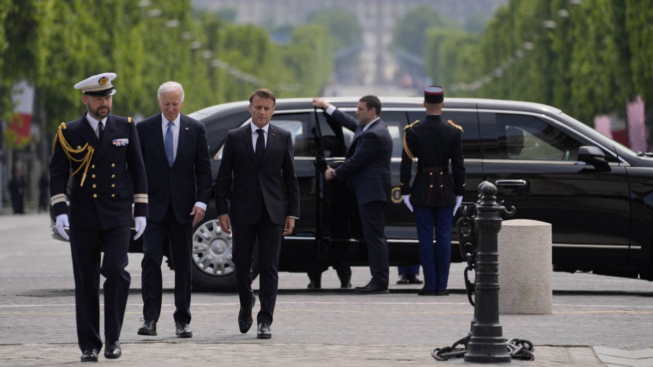 President Joe Biden and French President Emmanuel Macron arrive to lay a wreath at the tomb of the Unknown soldier under the Arc de Triomphe, Saturday, June 8, 2024 in Paris. (AP Photo/Evan Vucci)