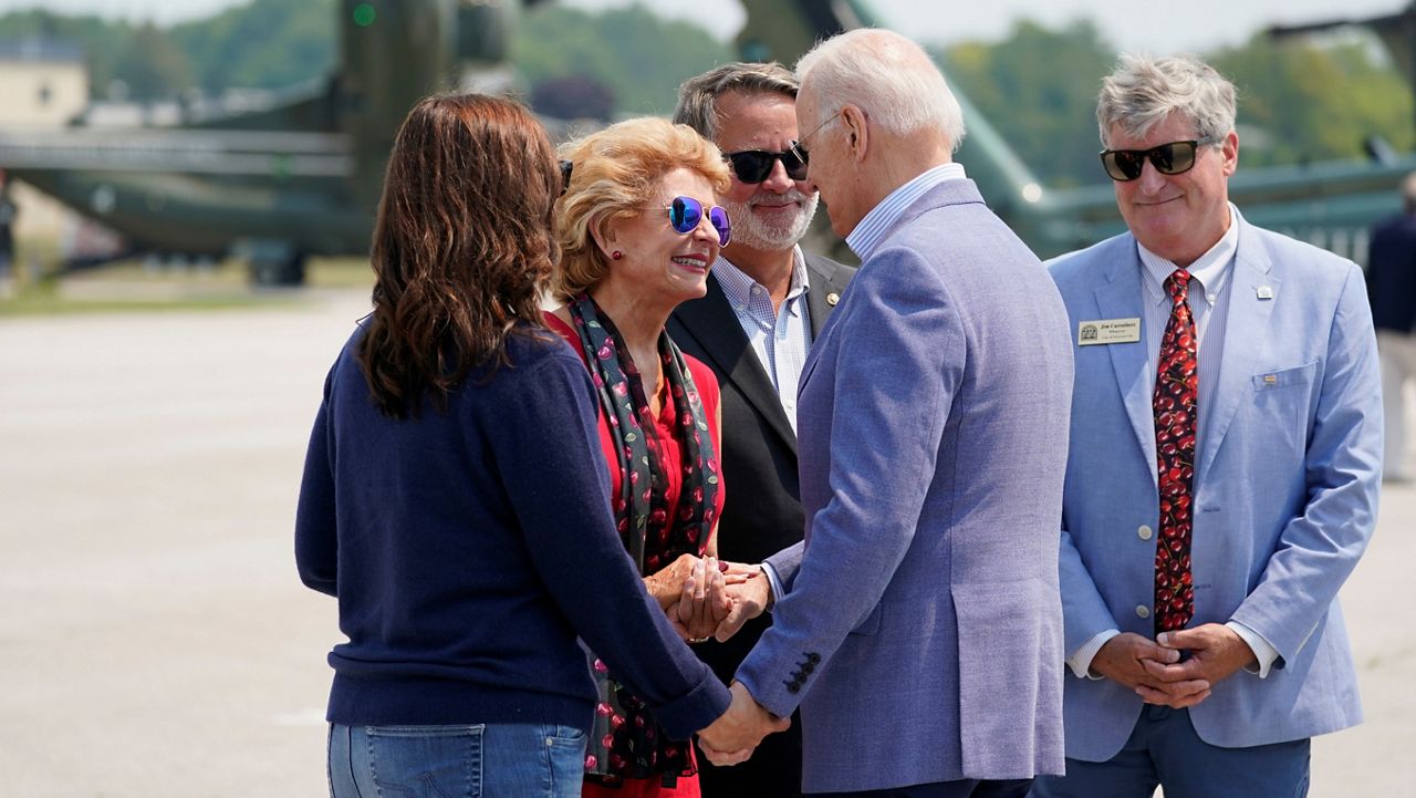 President Biden is greeted by Michigan Gov. Gretchen Whitmer, Sens. Debbie Stabenow and Gary Peters, D-Mich., and Traverse City Mayor Jim Carruthers in Traverse City. (AP/Alex Brandon)