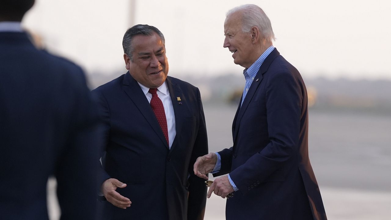 President Joe Biden greets Peru's Prime Minister Gustavo Adrianzen as he arrives at Jorge Chavez International Airport in Lima, Peru, Thursday, Nov. 14, 2024, to attend the APEC summit. (AP Photo/Manuel Balce Ceneta)