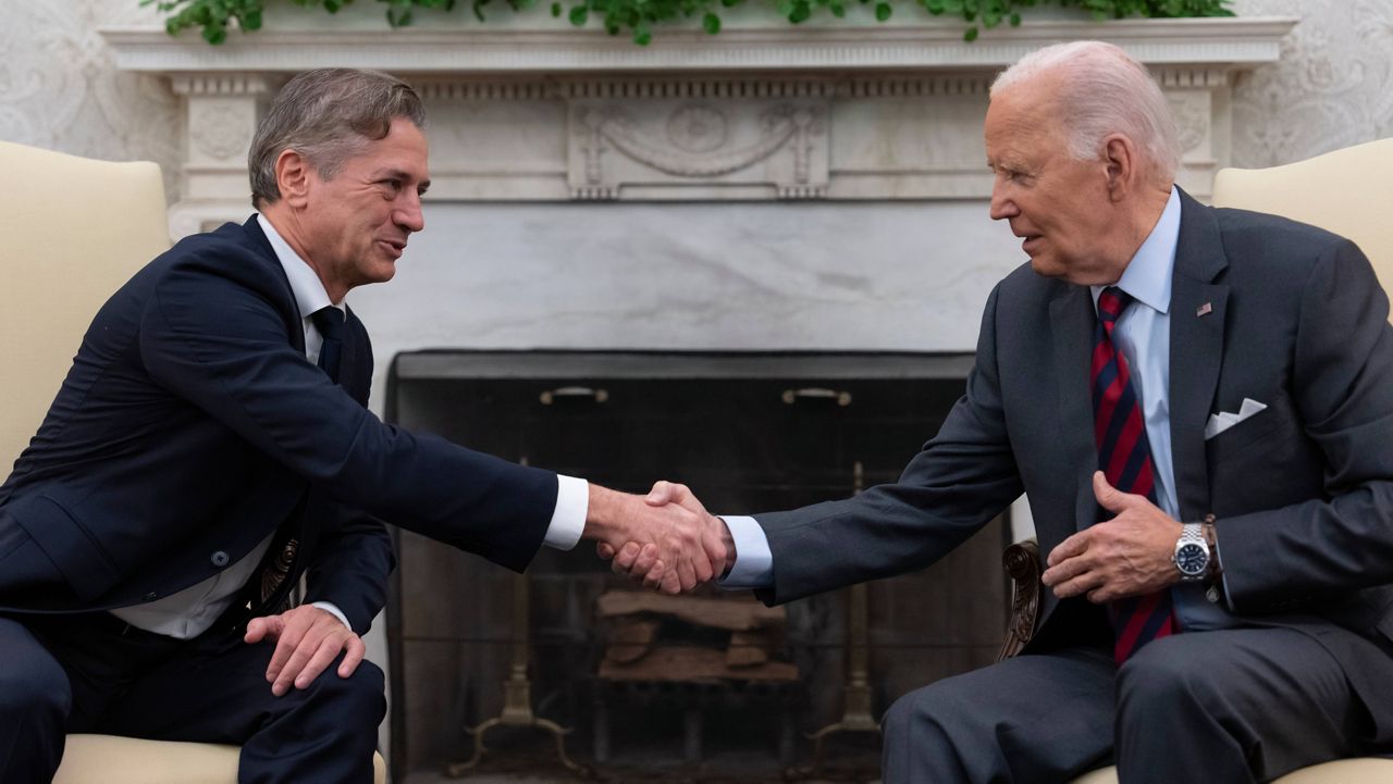 President Joe Biden shakes hands with Slovenian Prime Minister Robert Golob, left, as they meet in the Oval Office of the White House in Washington, Tuesday, Oct. 22, 2024. (AP Photo/Ben Curtis)