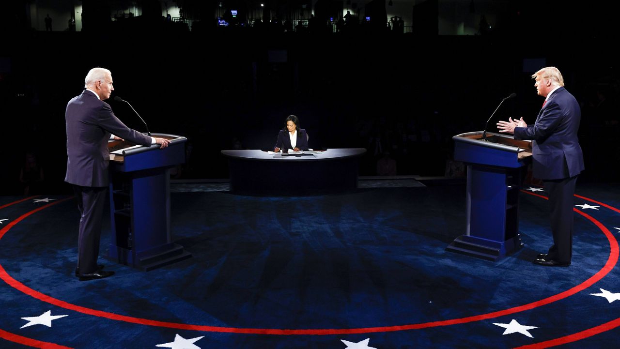 Donald Trump and Joe Biden participate in the final presidential debate on Oct. 22, 2020, in Nashville, Tenn. (Jim Bourg/Pool via AP)