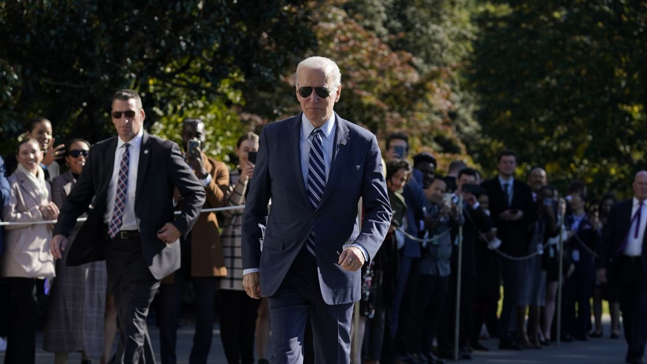 President Joe Biden walks to talk with reporters before boarding Marine One on the South Lawn of the White House, Thursday, Oct. 20, 2022, in Washington. (AP Photo/Evan Vucci)