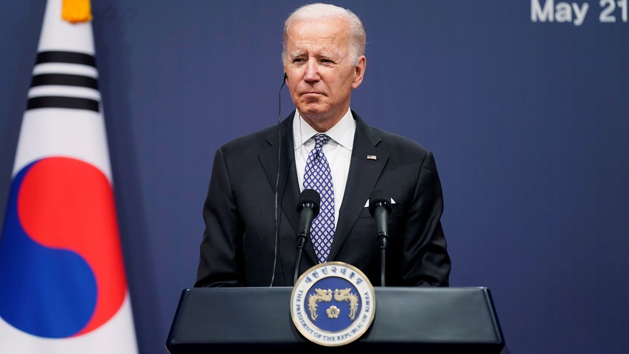 U.S. President Joe Biden listens as South Korean President Yoon Suk Yeol speaks during a news conference at the People's House inside the Ministry of National Defense, Saturday, May 21, 2022, in Seoul, South Korea. (AP Photo/Evan Vucci)
