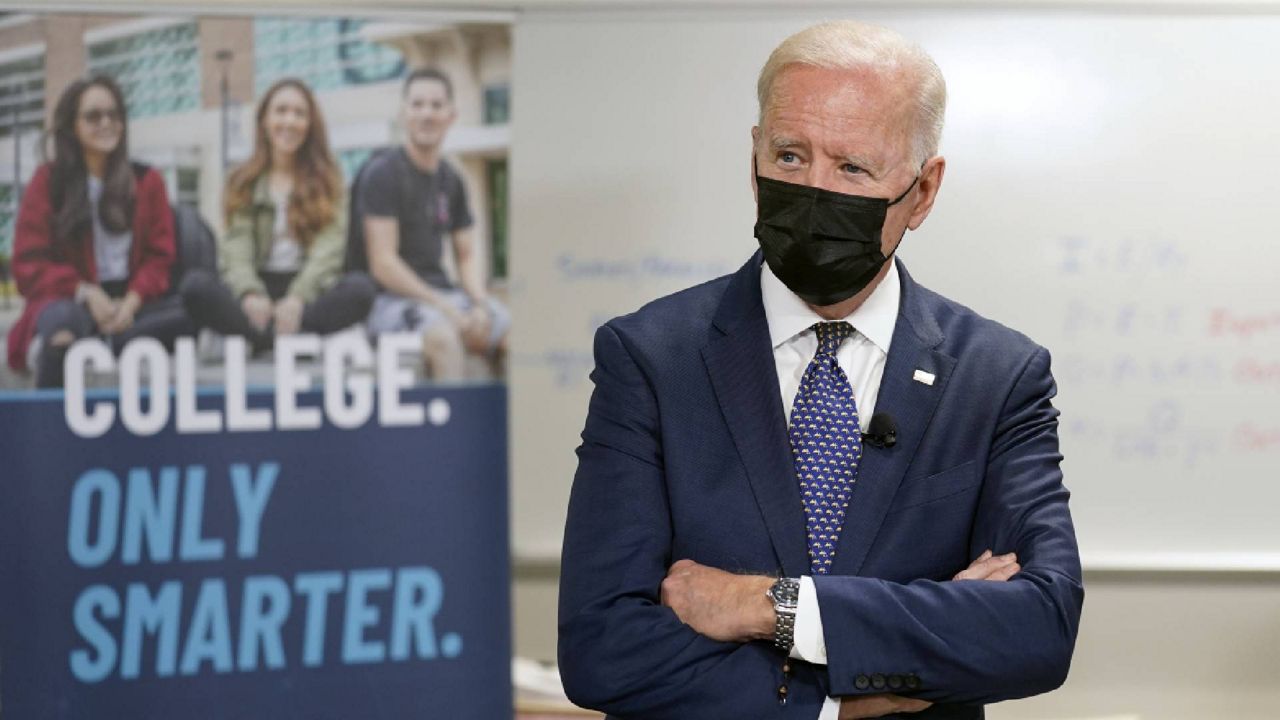 FILE - President Joe Biden tours an HVAC workshop at Tidewater Community College, Monday, May 3, 2021, in Portsmouth, Va. (AP Photo/Evan Vucci)