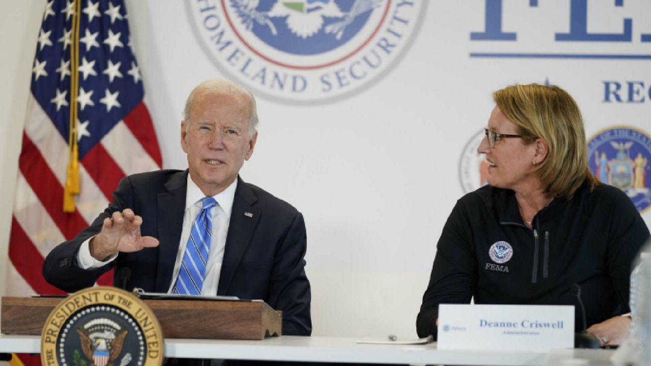Federal Emergency Management Agency administrator Deanne Criswell, right, listens as President Joe Biden speaks during a visit to the FEMA Region 2 office in New York, Thursday, Sept. 22, 2022. (AP Photo/Evan Vucci)
