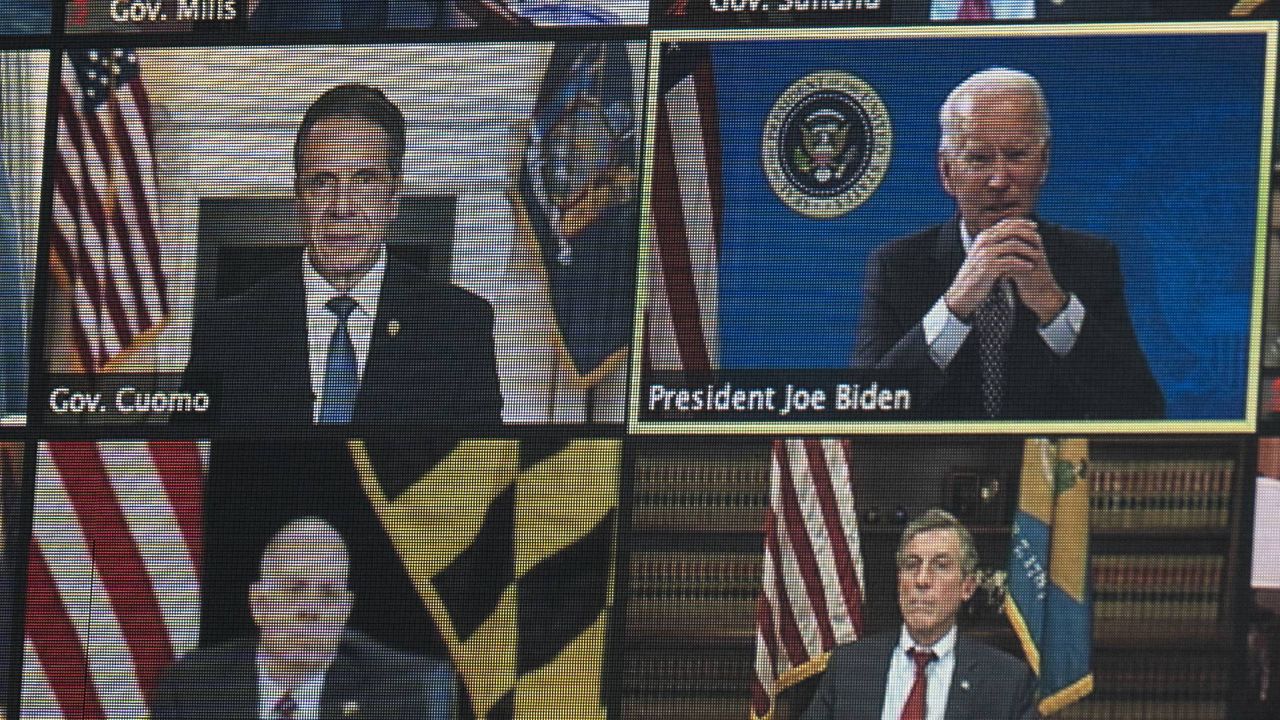President Joe Biden is seen on a screen as he speaks during a virtual meeting of the National Governors Association, in the South Court Auditorium on the White House campus, Thursday, Feb. 25, 2021, in Washington. (AP Photo/Evan Vucci)